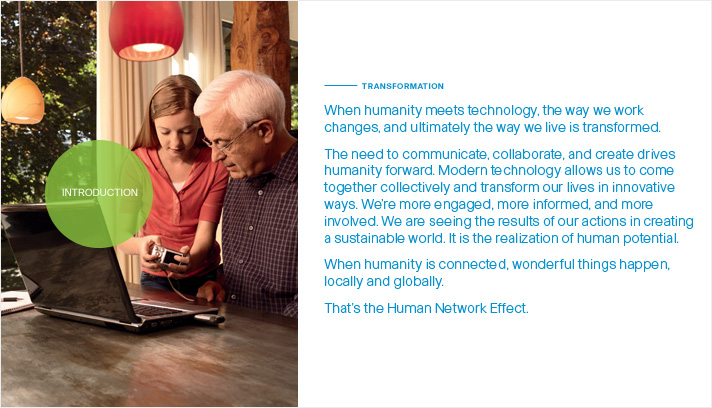 The Human Network Effect Cisco Systems, Inc. 2008 Annual Report Photo of a granddaughter showing her grandfather how to download photos from a digital camera onto a laptop computer in a home dining room.